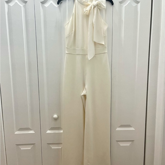 Vince Camuto Sleeveless Bow Tie Mock Neck Jumpsuit - Picture 1 of 5